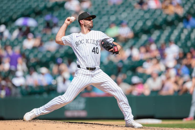 Jun 5, 2024; Denver, Colorado, USA; Colorado Rockies relief pitcher Tyler Kinley (40) delivers a pitch during the eighth inning against the Cincinnati Reds at Coors Field. Mandatory Credit: Andrew Wevers-USA TODAY Sports