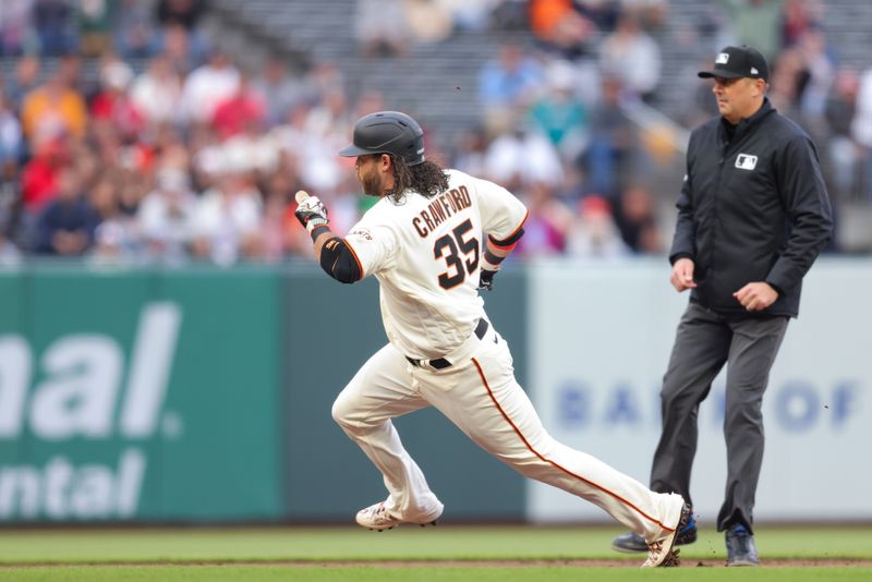 Jul 5, 2023; San Francisco, California, USA; San Francisco Giants shortstop Brandon Crawford (35) runs to third during the third inning against the Seattle Mariners at Oracle Park. Mandatory Credit: Sergio Estrada-USA TODAY Sports