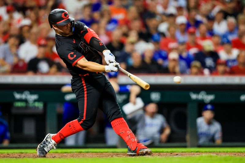 Aug 16, 2024; Cincinnati, Ohio, USA; Cincinnati Reds first baseman Ty France (2) hits a double in the seventh inning against the Kansas City Royals at Great American Ball Park. Mandatory Credit: Katie Stratman-USA TODAY Sports