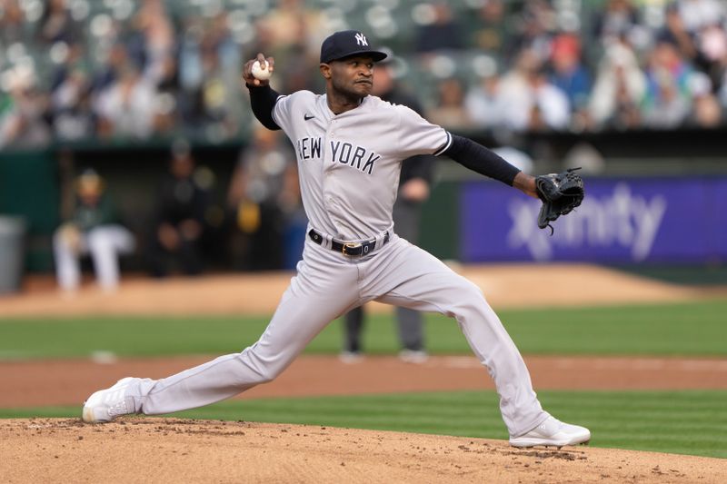 Jun 28, 2023; Oakland, California, USA;  New York Yankees starting pitcher Domingo German (0) pitches during the first inning against the Oakland Athletics at Oakland-Alameda County Coliseum. Mandatory Credit: Stan Szeto-USA TODAY Sports