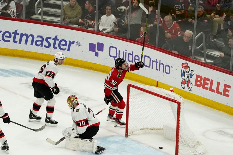 Feb 17, 2024; Chicago, Illinois, USA; Chicago Blackhawks center Connor Bedard (98) celebrates his goal against Ottawa Senators goaltender Joonas Korpisalo (70) during the second period at United Center. Mandatory Credit: David Banks-USA TODAY Sports