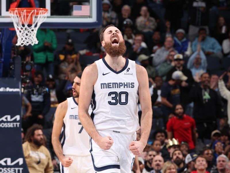 MEMPHIS, TN - DECEMBER 5: Jay Huff #30 of the Memphis Grizzlies celebrates during the game against the Sacramento Kings on December 5, 2024 at FedExForum in Memphis, Tennessee. NOTE TO USER: User expressly acknowledges and agrees that, by downloading and or using this photograph, User is consenting to the terms and conditions of the Getty Images License Agreement. Mandatory Copyright Notice: Copyright 2024 NBAE (Photo by Joe Murphy/NBAE via Getty Images)