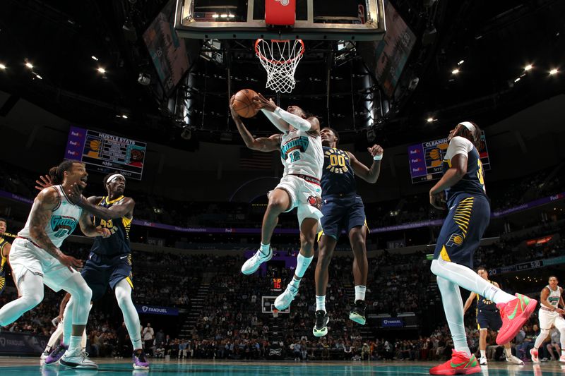 MEMPHIS, TN - DECEMBER 1: Ja Morant #12 of the Memphis Grizzlies drives to the basket during the game against the Indiana Pacers on December 1, 2024 at FedExForum in Memphis, Tennessee. NOTE TO USER: User expressly acknowledges and agrees that, by downloading and or using this photograph, User is consenting to the terms and conditions of the Getty Images License Agreement. Mandatory Copyright Notice: Copyright 2024 NBAE (Photo by Joe Murphy/NBAE via Getty Images)