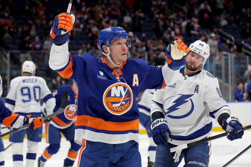Dec 2, 2025; Elmont, New York, USA; New York Islanders center Bo Horvat (14) celebrates his goal against the Tampa Bay Lightning during the second period at UBS Arena. Mandatory Credit: Brad Penner-Imagn Images