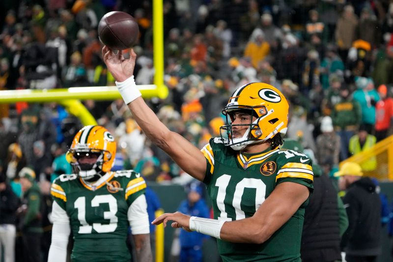Green Bay Packers quarterback Jordan Love (10) warms up before an NFL football game against the Miami Dolphins Thursday, Nov. 28, 2024, in Green Bay, Wis. (AP Photo/Morry Gash)