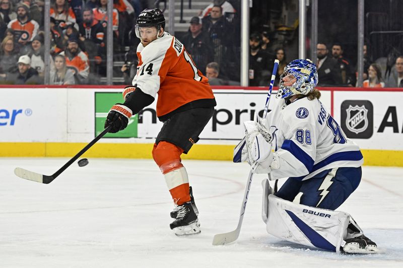 Jan 23, 2024; Philadelphia, Pennsylvania, USA; Philadelphia Flyers center Sean Couturier (14) deflects the puck against Tampa Bay Lightning goaltender Andrei Vasilevskiy (88) during the first period at Wells Fargo Center. Mandatory Credit: Eric Hartline-USA TODAY Sports