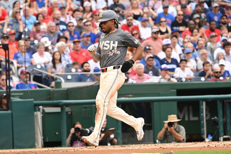 Aug 31, 2024; Washington, District of Columbia, USA; Washington Nationals shortstop Jose Tena (8) scores a run against the Chicago Cubs during the second inning at Nationals Park. Mandatory Credit: Rafael Suanes-USA TODAY Sports