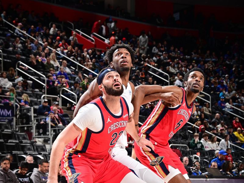 DETROIT, MI - MARCH 24: Larry Nance Jr. #22 and Herb Jones #5 of the New Orleans Pelicans box out against James Wiseman #13 of the Detroit Pistons during the game on March 24, 2024 at Little Caesars Arena in Detroit, Michigan. NOTE TO USER: User expressly acknowledges and agrees that, by downloading and/or using this photograph, User is consenting to the terms and conditions of the Getty Images License Agreement. Mandatory Copyright Notice: Copyright 2024 NBAE (Photo by Chris Schwegler/NBAE via Getty Images)