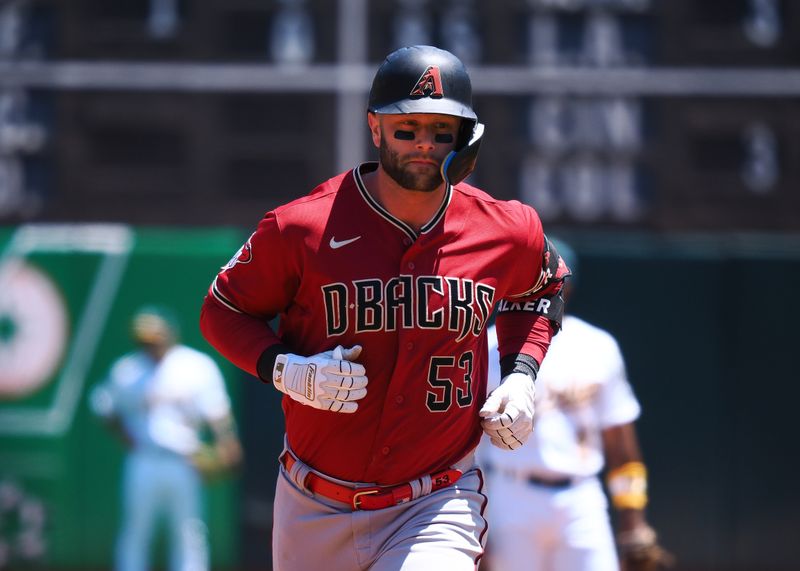 May 17, 2023; Oakland, California, USA; Arizona Diamondbacks first baseman Christian Walker (53) rounds the bases on a solo home run against the Oakland Athletics during the second inning at Oakland-Alameda County Coliseum. Mandatory Credit: Kelley L Cox-USA TODAY Sports