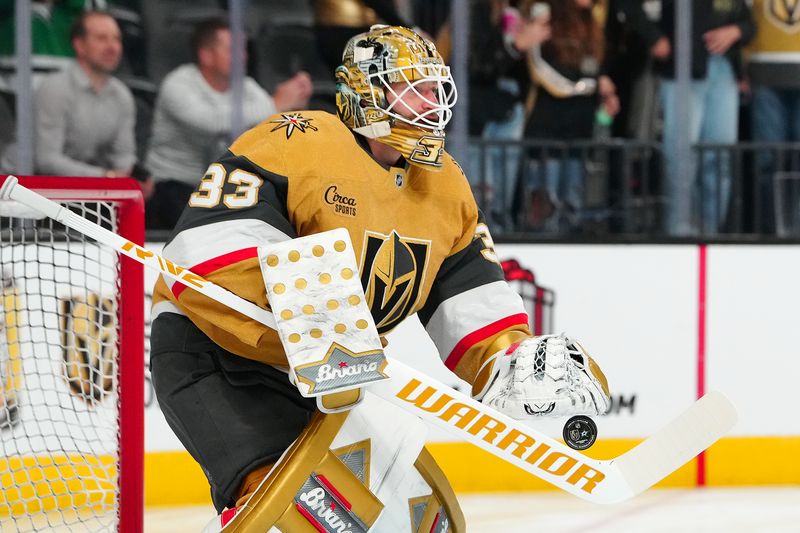 Dec 6, 2024; Las Vegas, Nevada, USA; Vegas Golden Knights goaltender Adin Hill (33) warms up before a game against the Dallas Stars at T-Mobile Arena. Mandatory Credit: Stephen R. Sylvanie-Imagn Images