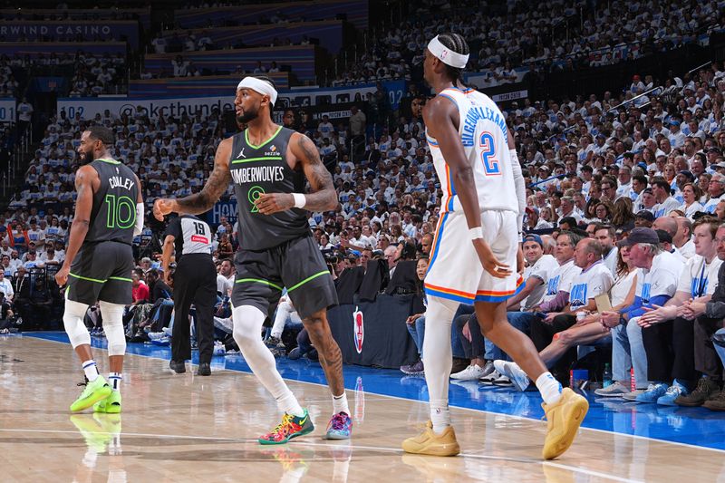 OKLAHOMA CITY, OK - MAY 20: Nickeil Alexander-Walker #9 of the Minnesota Timberwolves and Shai Gilgeous-Alexander #2 of the Oklahoma City Thunder look on during the game during Game One of the Western Conference Finals on May 20, 2025 at Paycom Center in Oklahoma City, Oklahoma. NOTE TO USER: User expressly acknowledges and agrees that, by downloading and or using this photograph, User is consenting to the terms and conditions of the Getty Images License Agreement. Mandatory Copyright Notice: Copyright 2025 NBAE (Photo by Garrett Ellwood/NBAE via Getty Images)