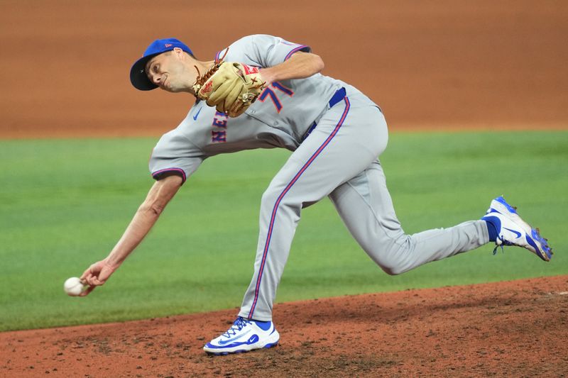 Sep 27, 2025; Miami, Florida, USA;  New York Mets pitcher Tyler Rogers (71) pitches in the eighth inning against the Miami Marlins at loanDepot Park. Mandatory Credit: Jim Rassol-Imagn Images