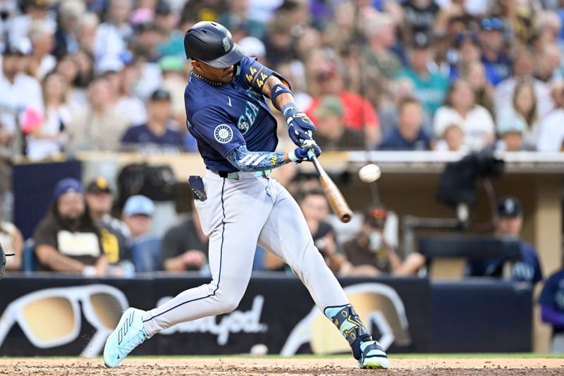 Jun 9, 2024; San Diego, California, USA; Seattle Mariners center fielder Julio Rodriguez (44) hits a solo home run during the fifth inning against the San Diego Padres at Petco Park. Mandatory Credit: Denis Poroy-USA TODAY Sports at Petco Park. 