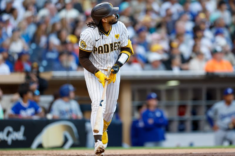 Jul 31, 2024; San Diego, California, USA; San Diego Padres catcher Luis Campusano (12) reacts after hitting a home run during the fourth inning against the Los Angeles Dodgers  at Petco Park. Mandatory Credit: David Frerker-USA TODAY Sports