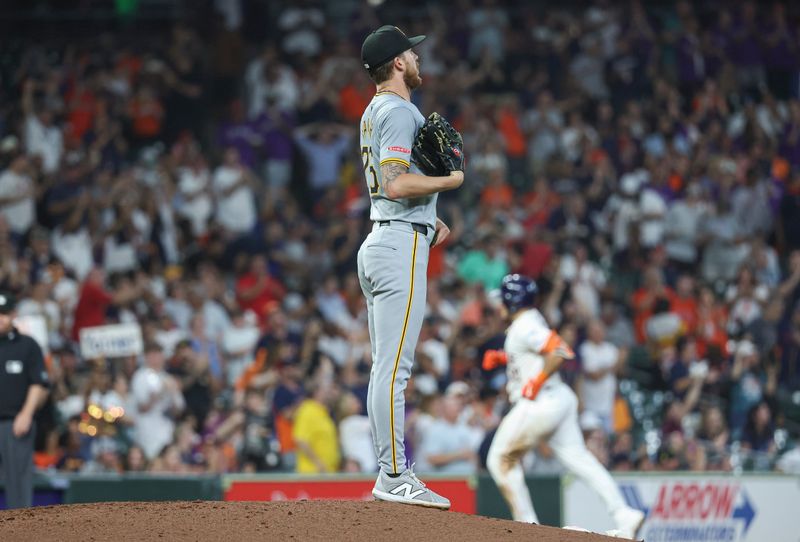 Jul 30, 2024; Houston, Texas, USA; Pittsburgh Pirates starting pitcher Bailey Falter (26) reacts and Houston Astros catcher Yainer Diaz (21) rounds the bases after hitting a  home run during the fourth inning at Minute Maid Park. Mandatory Credit: Troy Taormina-USA TODAY Sports