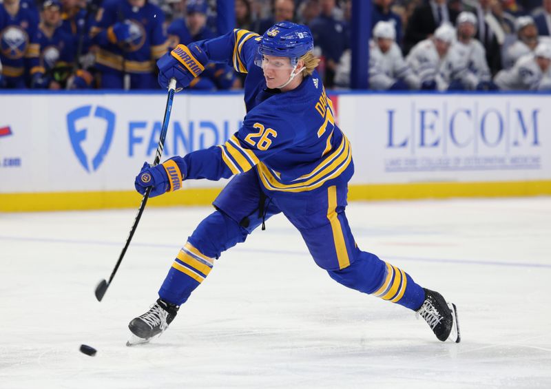 Dec 21, 2023; Buffalo, New York, USA;  Buffalo Sabres defenseman Rasmus Dahlin (26) takes a shot on goal and scores during the second period against the Toronto Maple Leafs at KeyBank Center. Mandatory Credit: Timothy T. Ludwig-USA TODAY Sports