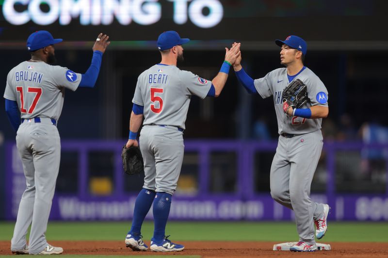 May 20, 2025; Miami, Florida, USA; Chicago Cubs right fielder Seiya Suzuki (27) celebrates with second baseman Jon Berti (5) after the game against the Miami Marlins at loanDepot Park. Mandatory Credit: Sam Navarro-Imagn Images