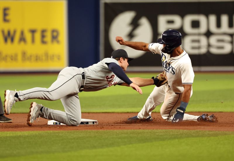 Apr 22, 2024; St. Petersburg, Florida, USA; Detroit Tigers second base Colt Keith (33) tags out Tampa Bay Rays outfielder Amed Rosario (10) as he attempted to steal second base during the first inning at Tropicana Field. Mandatory Credit: Kim Klement Neitzel-USA TODAY Sports