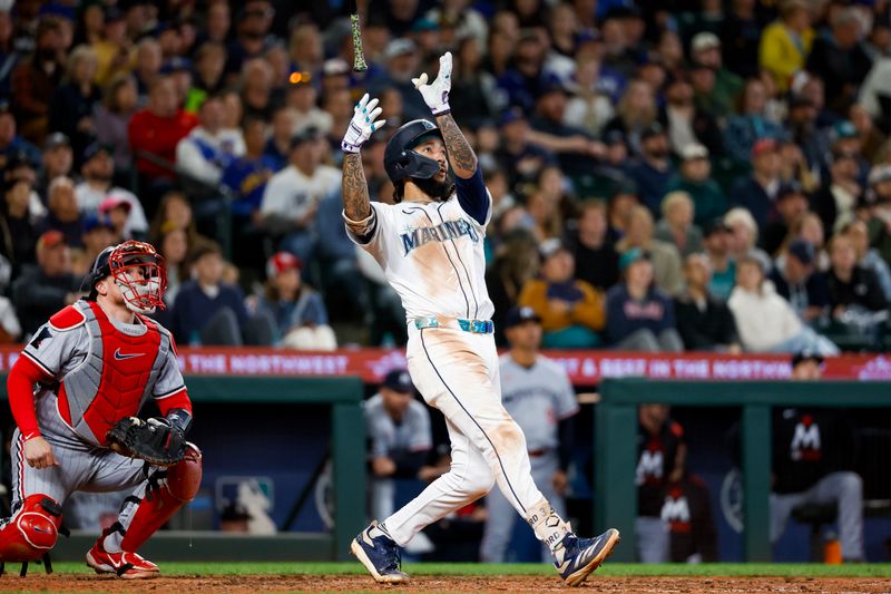 May 31, 2025; Seattle, Washington, USA; Seattle Mariners shortstop J.P. Crawford (3) hits a two-run home run against the Minnesota Twins during the seventh inning at T-Mobile Park. Mandatory Credit: Joe Nicholson-Imagn Images