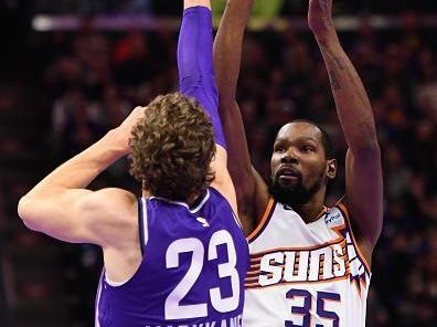 SALT LAKE CITY, UTAH - NOVEMBER 17: Kevin Durant #35 of the Phoenix Suns shoots over Lauri Markkanen #23 of the Utah Jazz during the first half of an NBA In-Season Tournament game at Delta Center on November 17, 2023 in Salt Lake City, Utah. NOTE TO USER: User expressly acknowledges and agrees that, by downloading and or using this photograph, User is consenting to the terms and conditions of the Getty Images License Agreement. (Photo by Alex Goodlett/Getty Images)