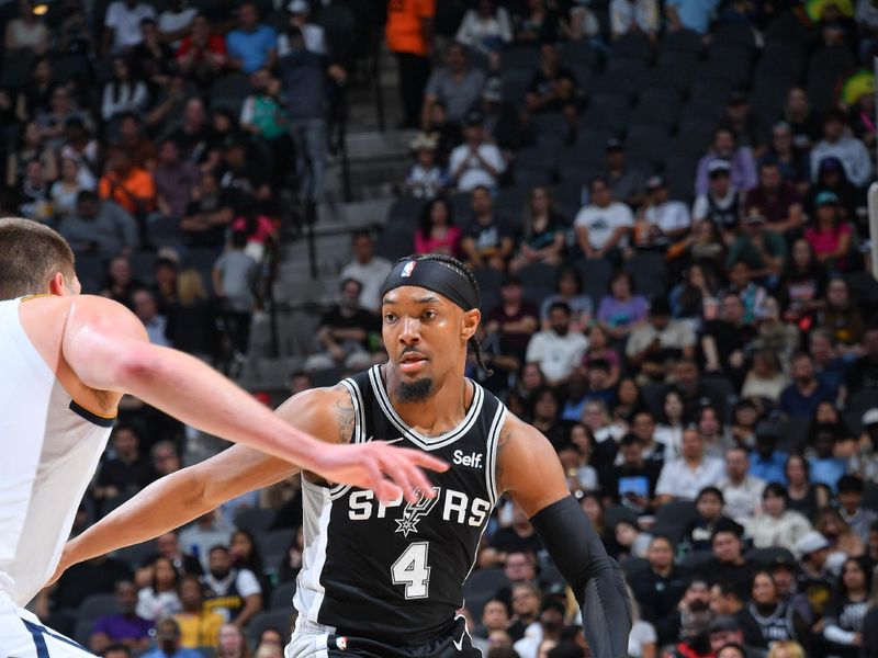 SAN ANTONIO, TX - APRIL 12:  Devonte Graham #4 of the San Antonio Spurs goes to the basket during the game on April 12, 2024 at the Frost Bank Center in San Antonio, Texas. NOTE TO USER: User expressly acknowledges and agrees that, by downloading and or using this photograph, user is consenting to the terms and conditions of the Getty Images License Agreement. Mandatory Copyright Notice: Copyright 2024 NBAE (Photos by Michael Gonzales/NBAE via Getty Images)