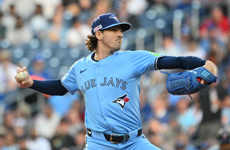 Jun 14, 2024; Toronto, Ontario, CAN;  Toronto Blue Jays starting pitcher Kevin Gausman (34) delivers a pitch against the Cleveland Indians in the first inning at Rogers Centre. Mandatory Credit: Dan Hamilton-USA TODAY Sports