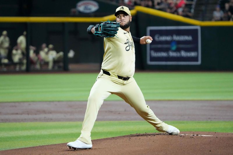 Aug 13, 2024; Phoenix, Arizona, USA; Arizona Diamondbacks pitcher Eduardo Rodriguez (57) pitches against the Colorado Rockies during the first inning at Chase Field. Mandatory Credit: Joe Camporeale-USA TODAY Sports