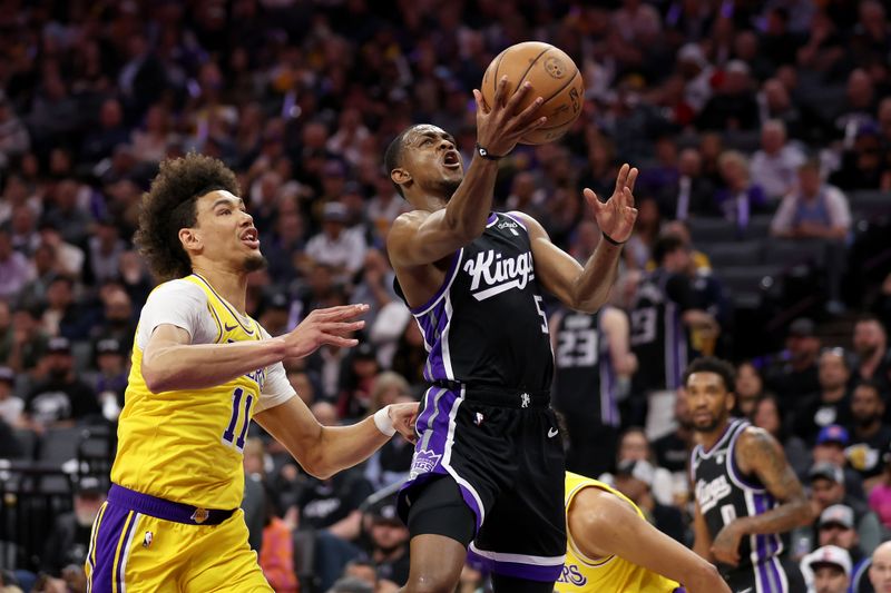 SACRAMENTO, CALIFORNIA - MARCH 13: De'Aaron Fox #5 of the Sacramento Kings goes up for a shot on Jaxson Hayes #11 of the Los Angeles Lakers in the first half at Golden 1 Center on March 13, 2024 in Sacramento, California. NOTE TO USER: User expressly acknowledges and agrees that, by downloading and or using this photograph, User is consenting to the terms and conditions of the Getty Images License Agreement.  (Photo by Ezra Shaw/Getty Images)