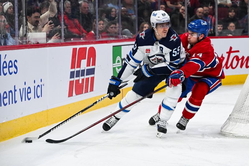 Jan 28, 2025; Montreal, Quebec, CAN; Winnipeg Jets center Mark Scheifele (55) plays the puck against Montreal Canadiens center Nick Suzuki (14) during the first period at Bell Centre. Mandatory Credit: David Kirouac-Imagn Images