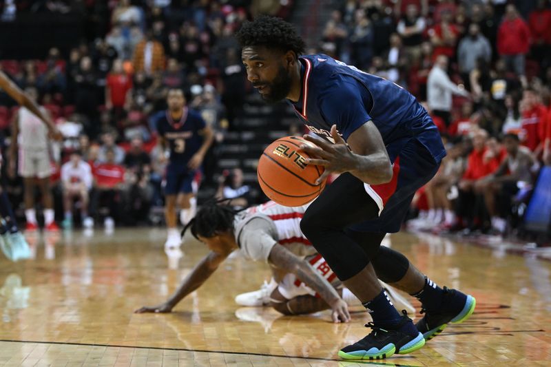 Feb 3, 2023; Las Vegas, Nevada, USA; Fresno State Bulldogs guard Jordan Campbell (5) steals the ball from UNLV Runnin' Rebels guard Keshon Gilbert (10) in the second half at Thomas & Mack Center. Mandatory Credit: Candice Ward-USA TODAY Sports