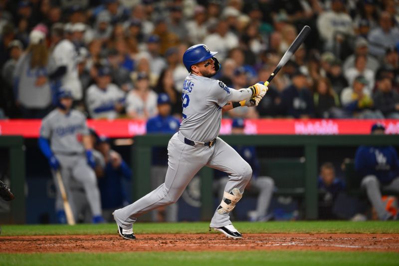 Sep 27, 2025; Seattle, Washington, USA; Los Angeles Dodgers second baseman Miguel Rojas (72) hits a double against the Seattle Mariners during the fifth inning at T-Mobile Park. Mandatory Credit: Steven Bisig-Imagn Images