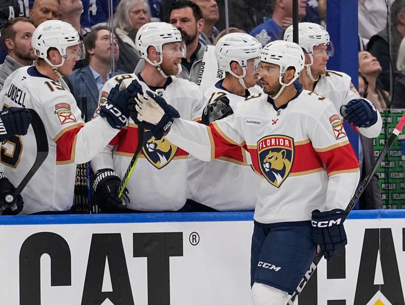May 5, 2025; Toronto, Ontario, CAN; Florida Panthers defenseman Seth Jones (3) geists congratulated after scoring against the Toronto Maple Leafs during the first period of the second round of the 2025 Stanley Cup Playoffs at Scotiabank Arena. Mandatory Credit: John E. Sokolowski-Imagn Images
