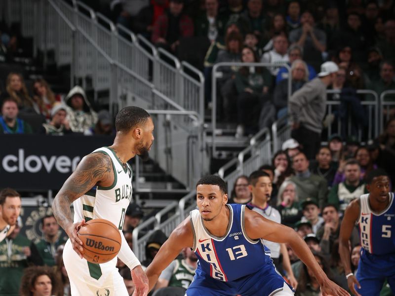 MILWAUKEE, WI - JANUARY 14: Keegan Murray #13 of the Sacramento Kings plays defense during the game against the Milwaukee Bucks on January 14, 2024 at the Fiserv Forum Center in Milwaukee, Wisconsin. NOTE TO USER: User expressly acknowledges and agrees that, by downloading and or using this Photograph, user is consenting to the terms and conditions of the Getty Images License Agreement. Mandatory Copyright Notice: Copyright 2024 NBAE (Photo by Gary Dineen/NBAE via Getty Images).