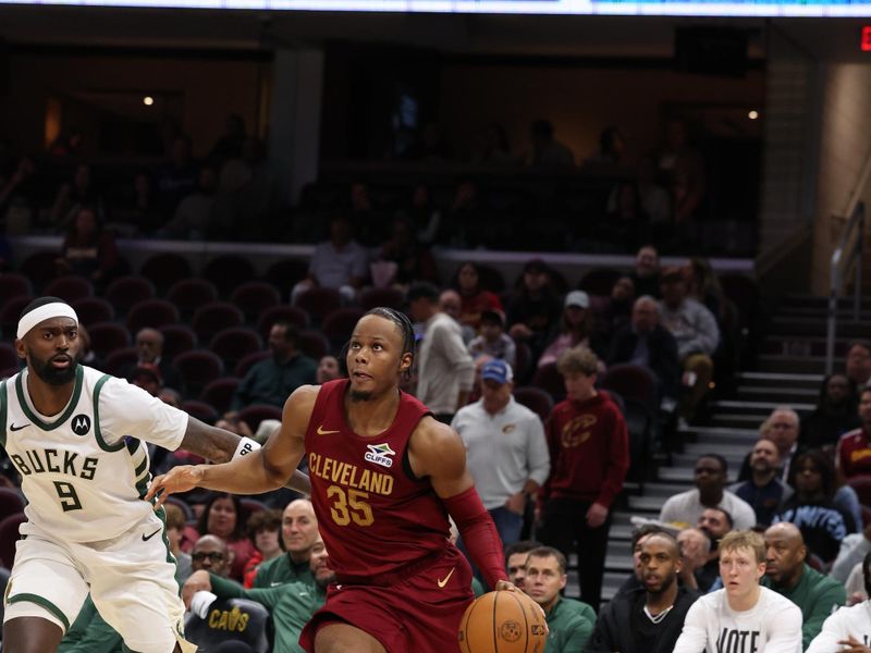 CLEVELAND, OH - NOVEMBER 4:  Isaac Okoro #35 of the Cleveland Cavaliers drives to the basket during the game against the Milwaukee Bucks on November 4, 2024 at Rocket Mortgage FieldHouse in Cleveland, Ohio. NOTE TO USER: User expressly acknowledges and agrees that, by downloading and/or using this Photograph, user is consenting to the terms and conditions of the Getty Images License Agreement. Mandatory Copyright Notice: Copyright 2024 NBAE (Photo by  Lauren Leigh Bacho/NBAE via Getty Images)