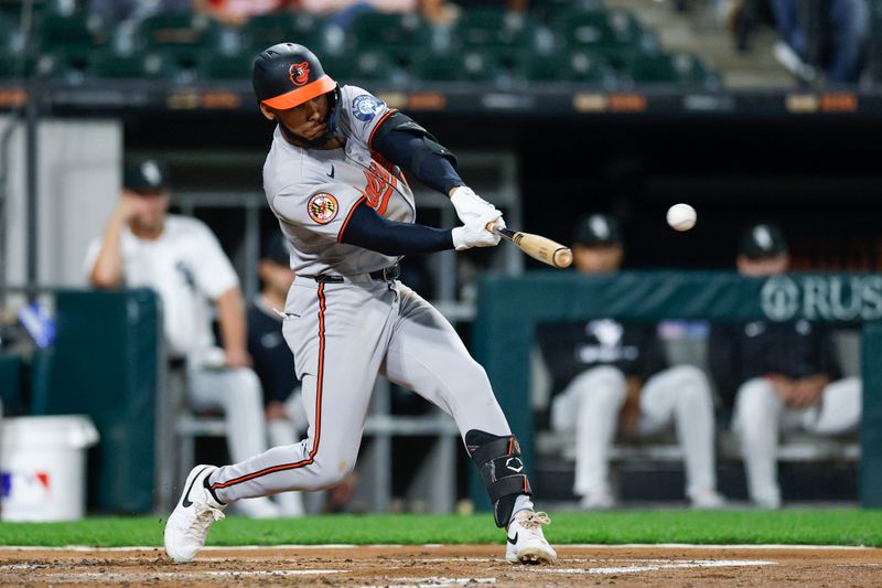 Sep 16, 2025; Chicago, Illinois, USA; Baltimore Orioles third baseman Jeremiah Jackson (82) hits an RBI-double against the Chicago White Sox during the third inning at Rate Field. Mandatory Credit: Kamil Krzaczynski-Imagn Images