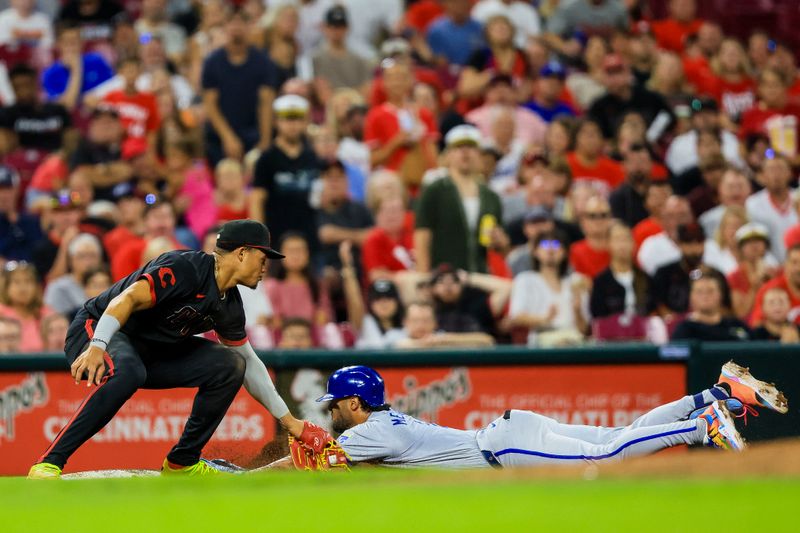Aug 16, 2024; Cincinnati, Ohio, USA; Cincinnati Reds third baseman Noelvi Marte (16) tags Kansas City Royals outfielder MJ Melendez (1) out at third in the eighth inning at Great American Ball Park. Mandatory Credit: Katie Stratman-USA TODAY Sports