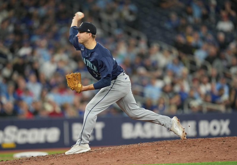 Apr 9, 2024; Toronto, Ontario, CAN; Seattle Mariners relief pitch Brett de Geus (59) throws a pitch against the Toronto Blue Jays during the eighth inning at Rogers Centre. Mandatory Credit: Nick Turchiaro-USA TODAY Sports