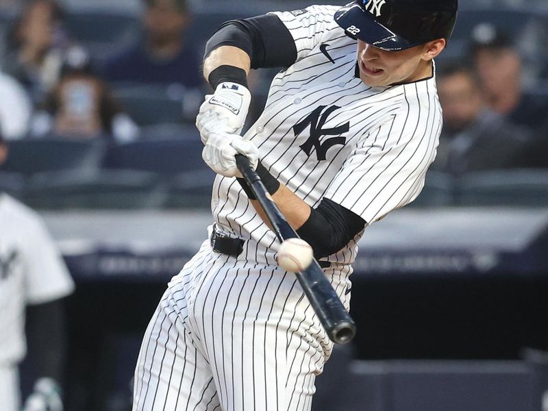 May 6, 2025; Bronx, New York, USA;  New York Yankees first baseman Ben Rice (22) hits a double in the first inning against the San Diego Padres at Yankee Stadium. Mandatory Credit: Wendell Cruz-Imagn Images