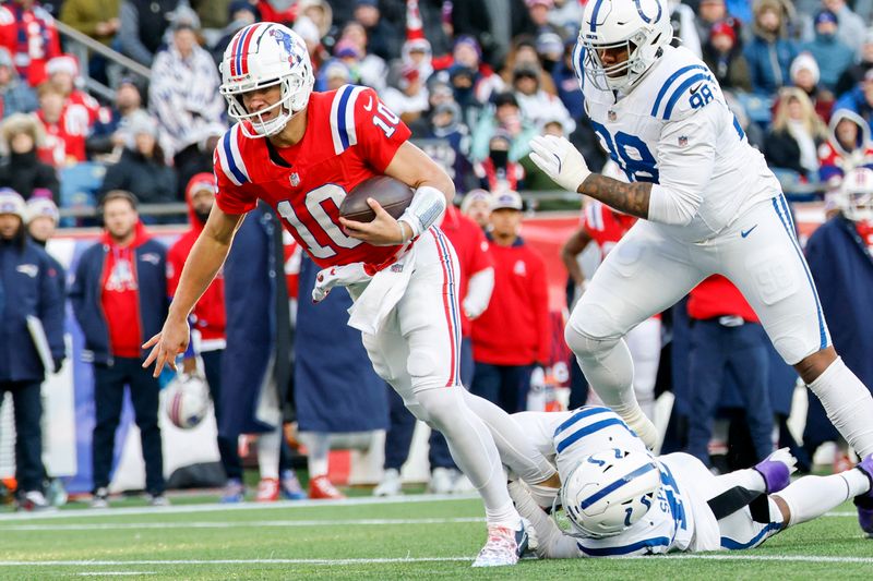 New England Patriots quarterback Drake Maye (10) is tackled by Indianapolis Colts linebacker E.J. Speed (45) during the second half of an NFL football game, Sunday, Dec. 1, 2024, in Foxborough, Mass. The Indianapolis Colts won 25-24. (AP Photo/Greg M. Cooper)