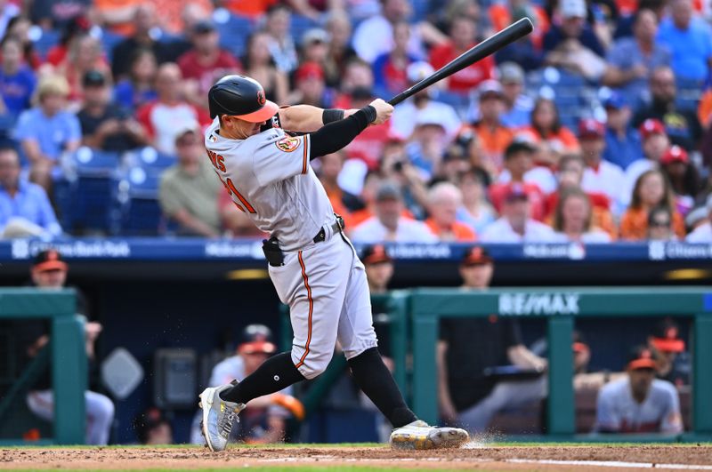 Jul 25, 2023; Philadelphia, Pennsylvania, USA; Baltimore Orioles outfielder Austin Hays (21) hits an RBI double against the Philadelphia Phillies in the second inning at Citizens Bank Park. Mandatory Credit: Kyle Ross-USA TODAY Sports