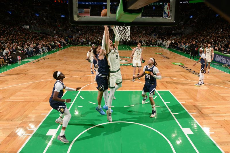 BOSTON, MA - JANUARY 19:  Kristaps Porzingis #8 of the Boston Celtics drives to the basket during the game against the Denver Nuggets on January 19, 2024 at the TD Garden in Boston, Massachusetts. NOTE TO USER: User expressly acknowledges and agrees that, by downloading and or using this photograph, User is consenting to the terms and conditions of the Getty Images License Agreement. Mandatory Copyright Notice: Copyright 2024 NBAE  (Photo by Brian Babineau/NBAE via Getty Images)