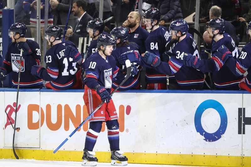 Jan 26, 2025; New York, New York, USA;  New York Rangers left wing Artemi Panarin (10) celebrates with his teammates after scoring a goal in the third period against the Colorado Avalanche at Madison Square Garden. Mandatory Credit: Wendell Cruz-Imagn Images