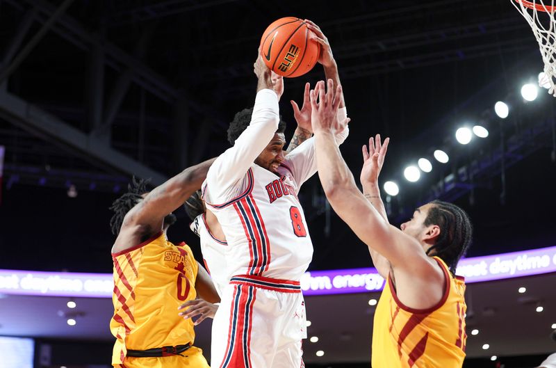 Feb 19, 2024; Houston, Texas, USA; Houston Cougars guard Mylik Wilson (8) attempts to control the ball during the first half against the Iowa State Cyclones at Fertitta Center. Mandatory Credit: Troy Taormina-USA TODAY Sports