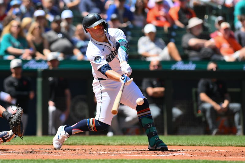 Jul 4, 2024; Seattle, Washington, USA; Seattle Mariners first baseman Ty France (23) hits a single against the Baltimore Orioles during the fifth inning at T-Mobile Park. Mandatory Credit: Steven Bisig-USA TODAY Sports