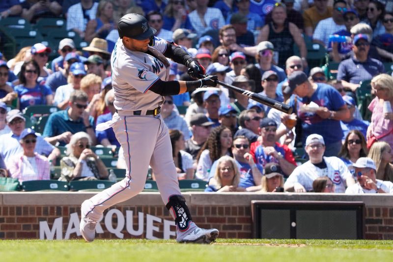 May 7, 2023; Chicago, Illinois, USA; Miami Marlins first baseman Yuli Gurriel (10) hits a home run against the Chicago Cubs during the fifth inning at Wrigley Field. Mandatory Credit: David Banks-USA TODAY Sports