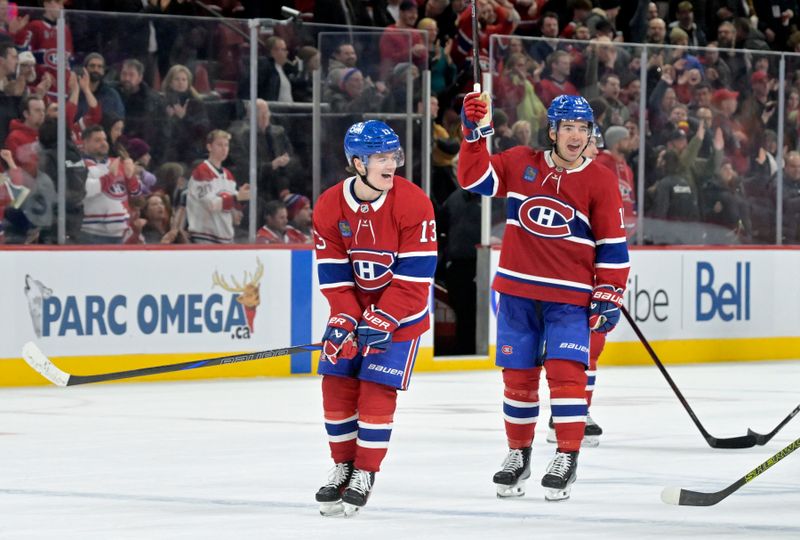 Jan 6, 2025; Montreal, Quebec, CAN; Montreal Canadiens forward Cole Caufield (13) celebrates the win against the Vancouver Canucks with teammate forward Alex Newhook (15) at the Bell Centre. Mandatory Credit: Eric Bolte-Imagn Images