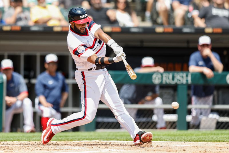 Jul 9, 2023; Chicago, Illinois, USA; Chicago White Sox shortstop Elvis Andrus (1) hits an RBI-single against the St. Louis Cardinals during the third inning at Guaranteed Rate Field. Mandatory Credit: Kamil Krzaczynski-USA TODAY Sports