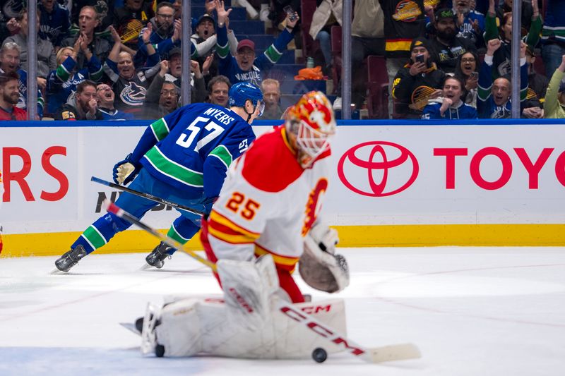 Apr 16, 2024; Vancouver, British Columbia, CAN; Vancouver Canucks defenseman Tyler Myers (57) celebrates his shorthanded goal scored on Calgary Flames goalie Jacob Markstrom (25) in the first period at Rogers Arena. Mandatory Credit: Bob Frid-USA TODAY Sports