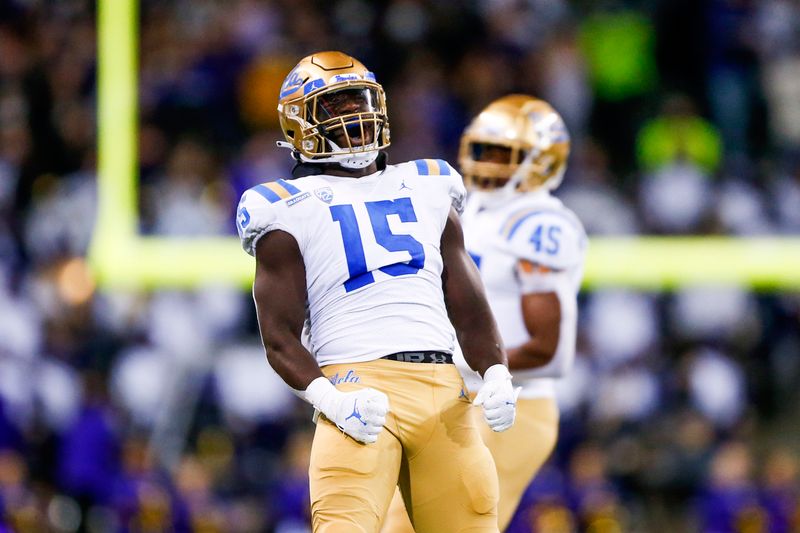 Oct 16, 2021; Seattle, Washington, USA; UCLA Bruins linebacker Jordan Genmark Heath (15) celebrates following a sack against the Washington Huskies during the third quarter at Alaska Airlines Field at Husky Stadium. Mandatory Credit: Joe Nicholson-USA TODAY Sports