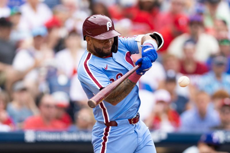 May 23, 2024; Philadelphia, Pennsylvania, USA; Philadelphia Phillies shortstop Edmundo Sosa (33) hits a double during the fourth inning against the Texas Rangers at Citizens Bank Park. Mandatory Credit: Bill Streicher-USA TODAY Sports